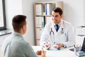 Doctor explaining oxycodone addiction treatment and detox to patient